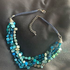20inch necklace with extender. Blue/ multicolor stones. Blue “leather” strands